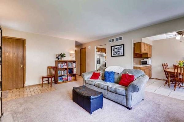21301 West Willow Road Lake Zurich, IL 60047 - Photo 5 of 14 a living room with furniture and a cabinet