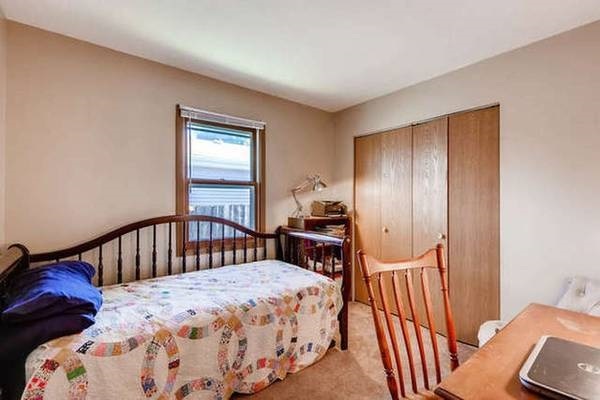 21301 West Willow Road Lake Zurich, IL 60047 - Photo 10 of 14 a bedroom with a bed and a window