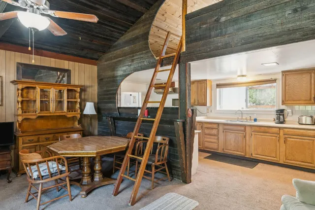 a dining room with furniture and window