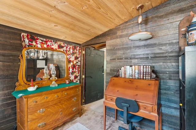 a room with furniture a lamp and a window