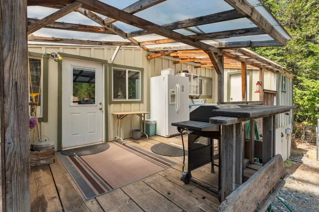 a view of balcony with wooden floor