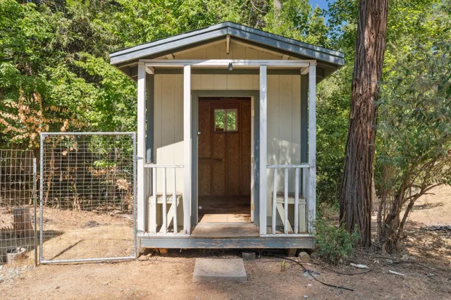 a view of a house with a small yard