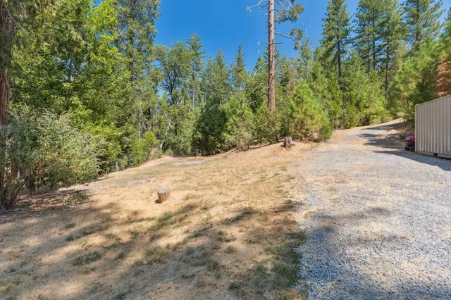 a view of a backyard of a house