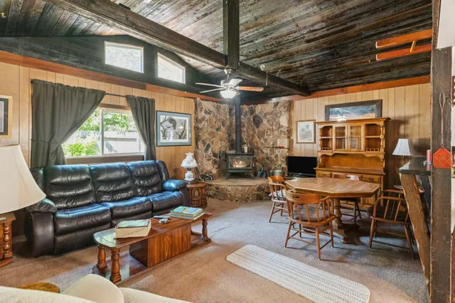 a living room with patio furniture and a window