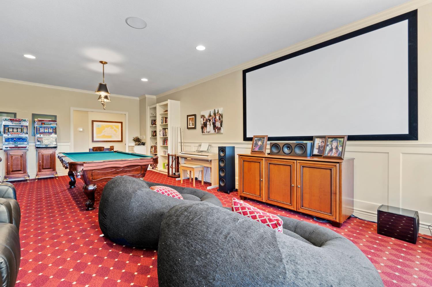 10676 Wilton Road Elk Grove, CA 95624 - Photo 59 of 71 a living room with furniture pool table and a flat screen tv
