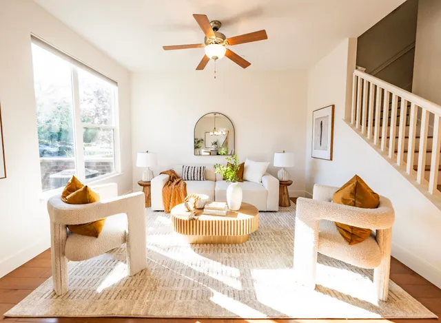 a living room with furniture and a large window