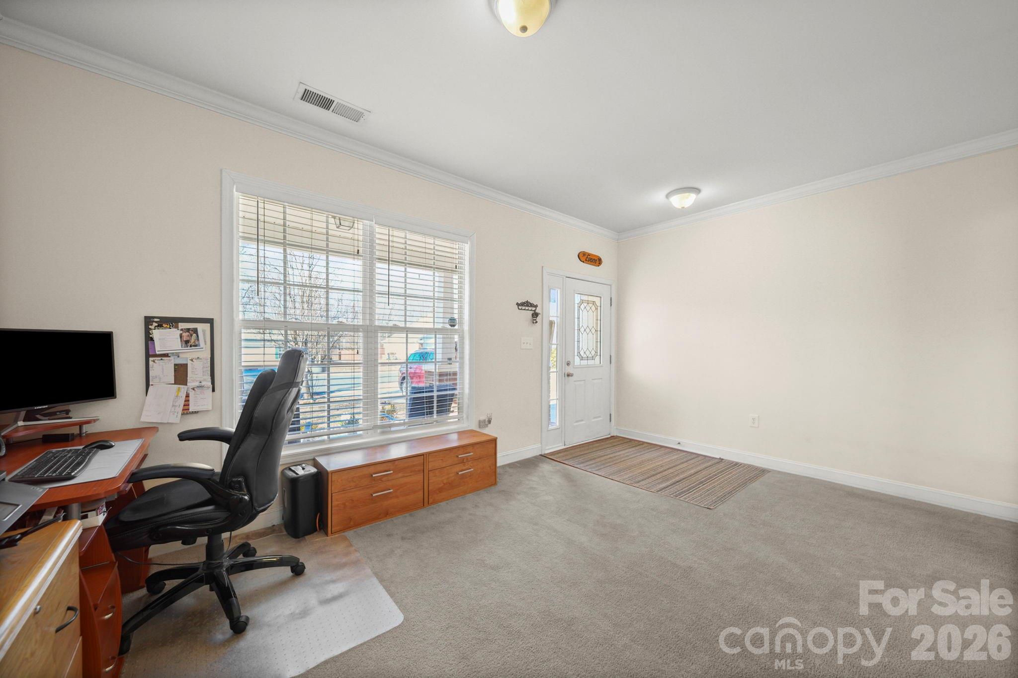 3035 Proverbs Court Monroe, NC 28110 - Photo 14 of 39 a view of a workspace with furniture and a window
