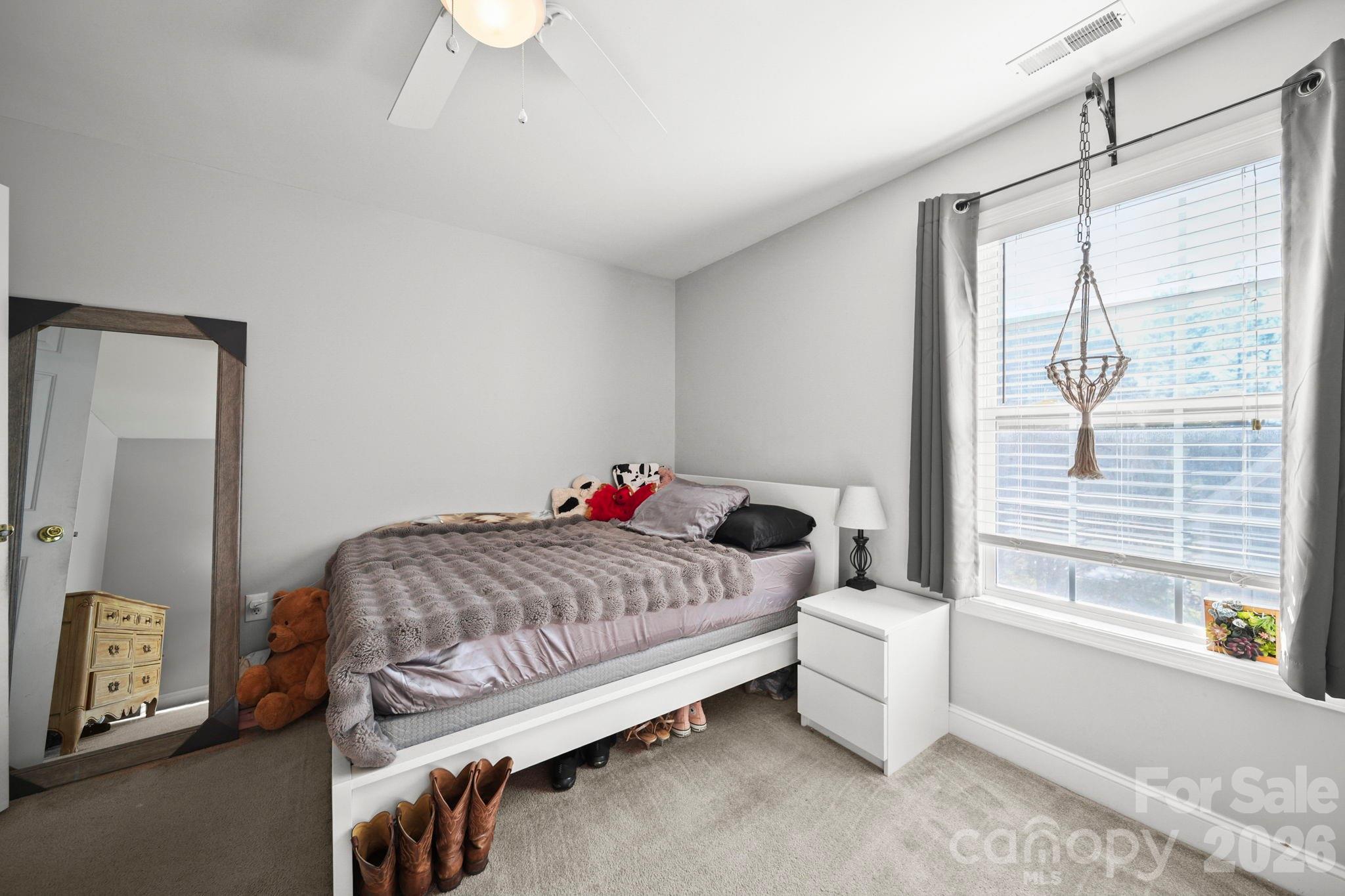 3035 Proverbs Court Monroe, NC 28110 - Photo 24 of 39 a bedroom with a bed and a window