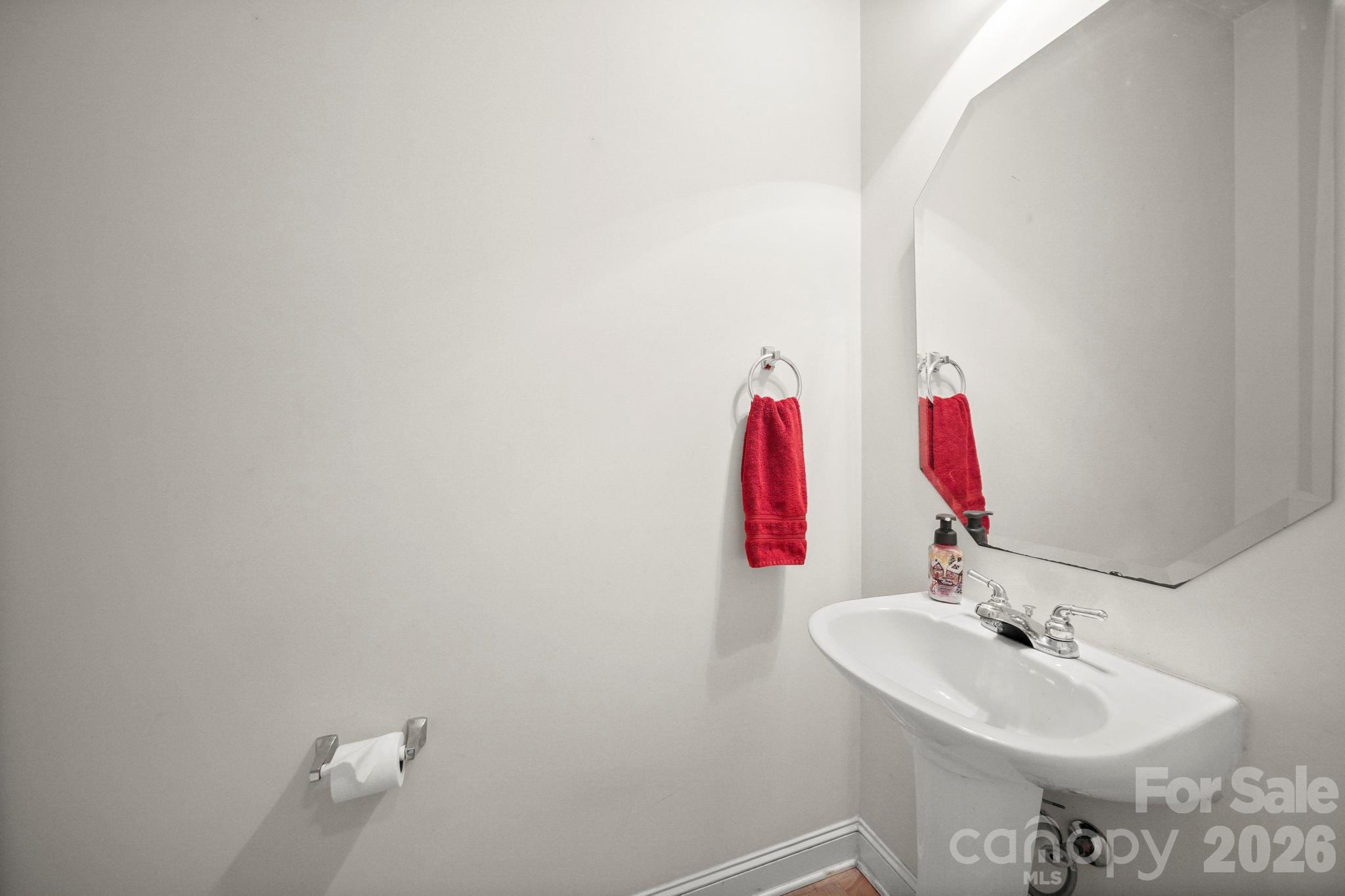 3035 Proverbs Court Monroe, NC 28110 - Photo 33 of 39 a bathroom with a sink and a mirror