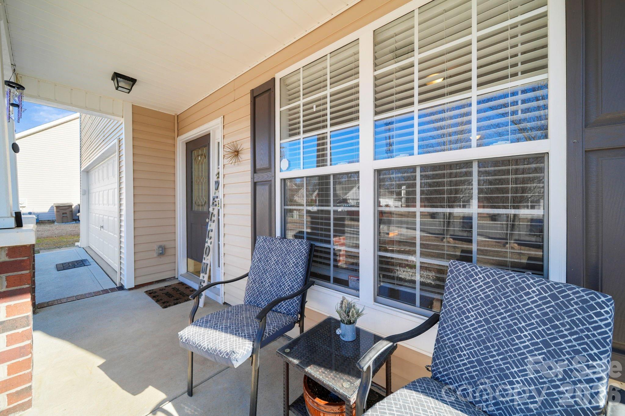 3035 Proverbs Court Monroe, NC 28110 - Photo 5 of 39 a balcony with furniture and a potted plant