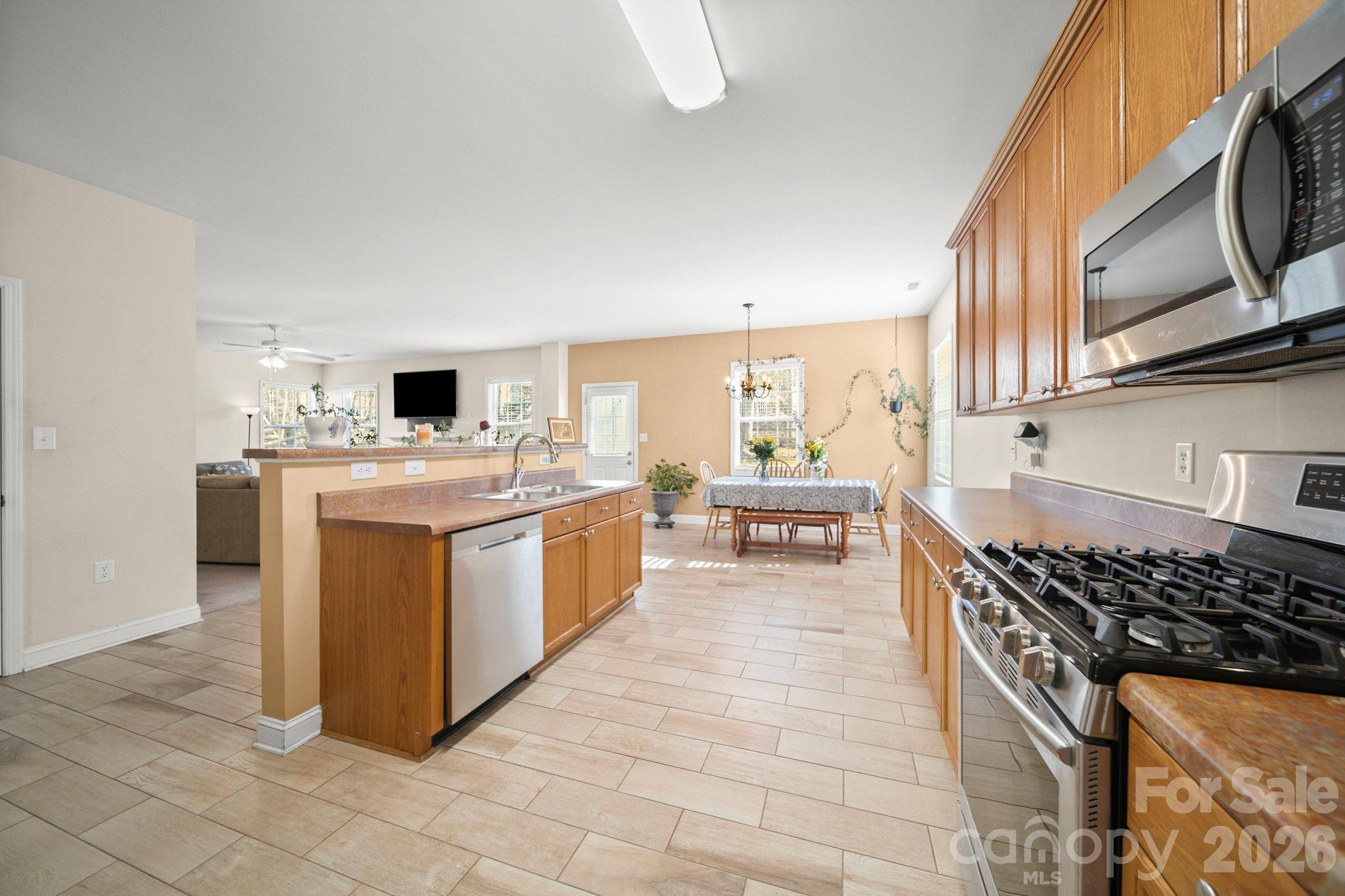 3035 Proverbs Court Monroe, NC 28110 - Photo 6 of 39 a kitchen with a stove top oven and cabinets