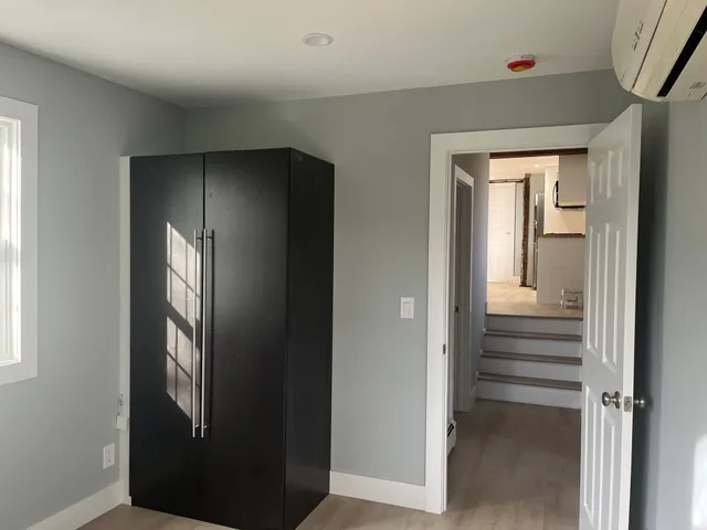 a view of staircase with wooden floor