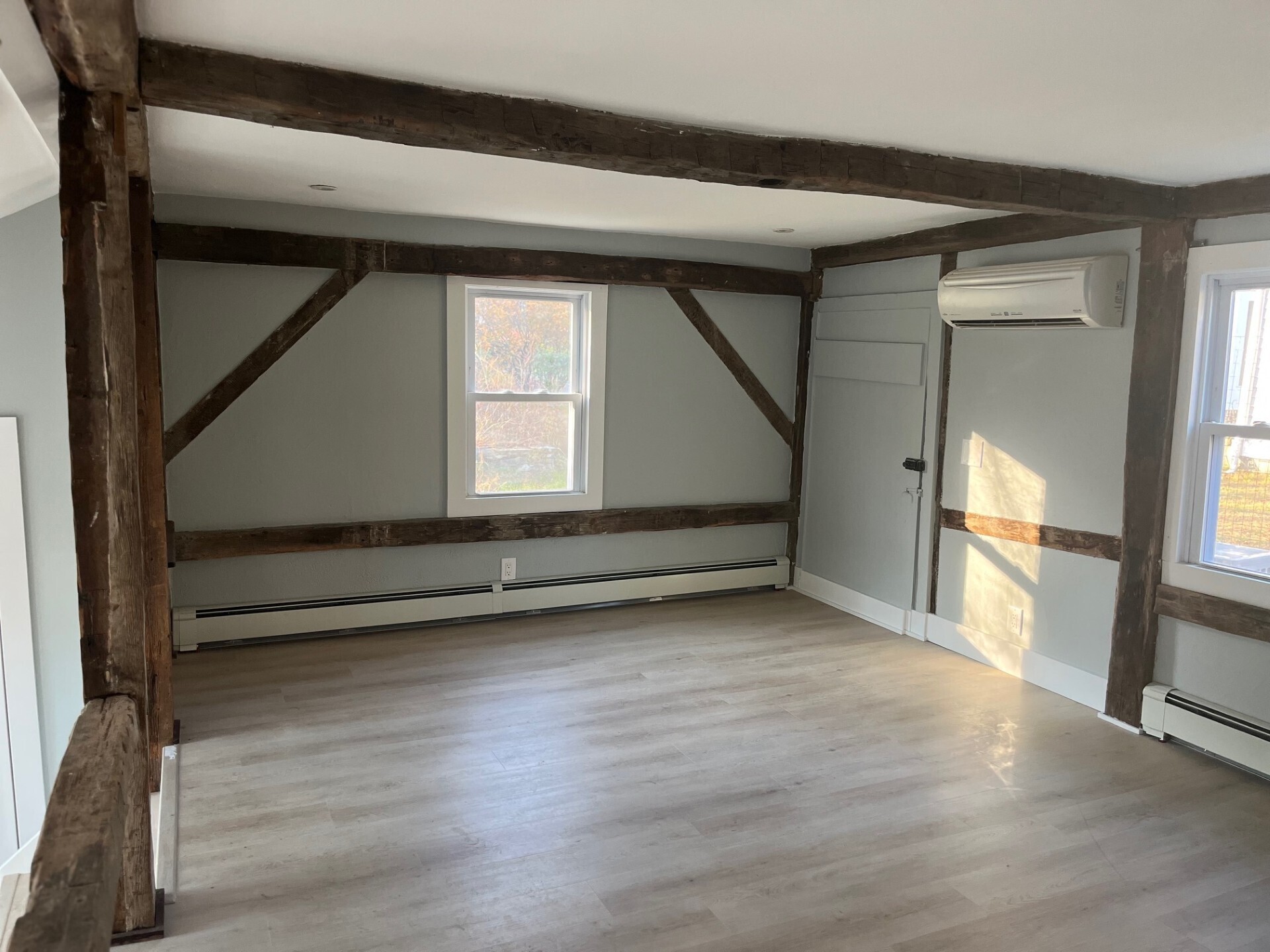 434 Hurlbutt Street Wilton, CT 06897 - Photo 2 of 14 a view of an empty room with wooden floor and a window
