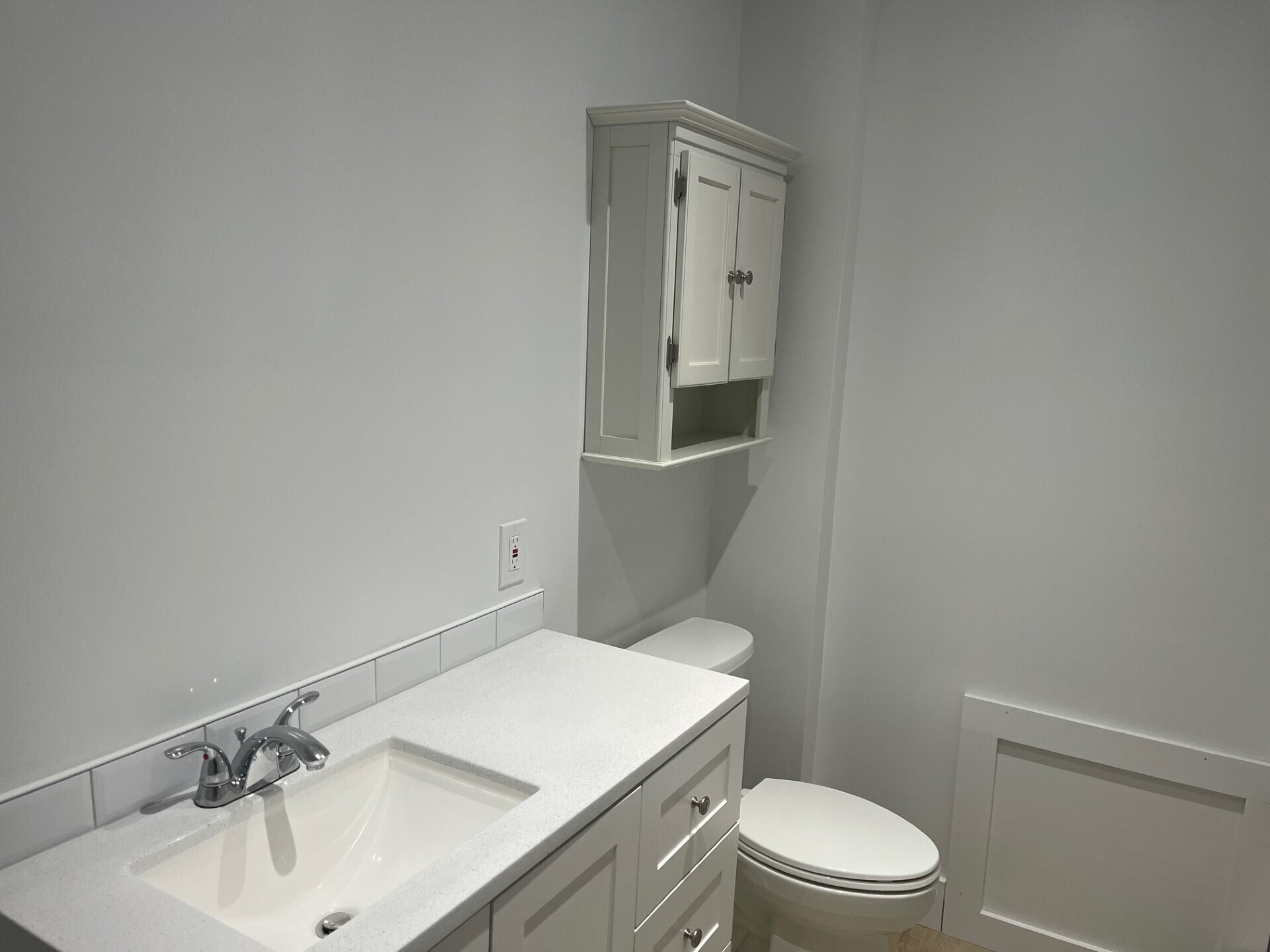 434 Hurlbutt Street Wilton, CT 06897 - Photo 6 of 14 a bathroom with a sink a toilet and mirror