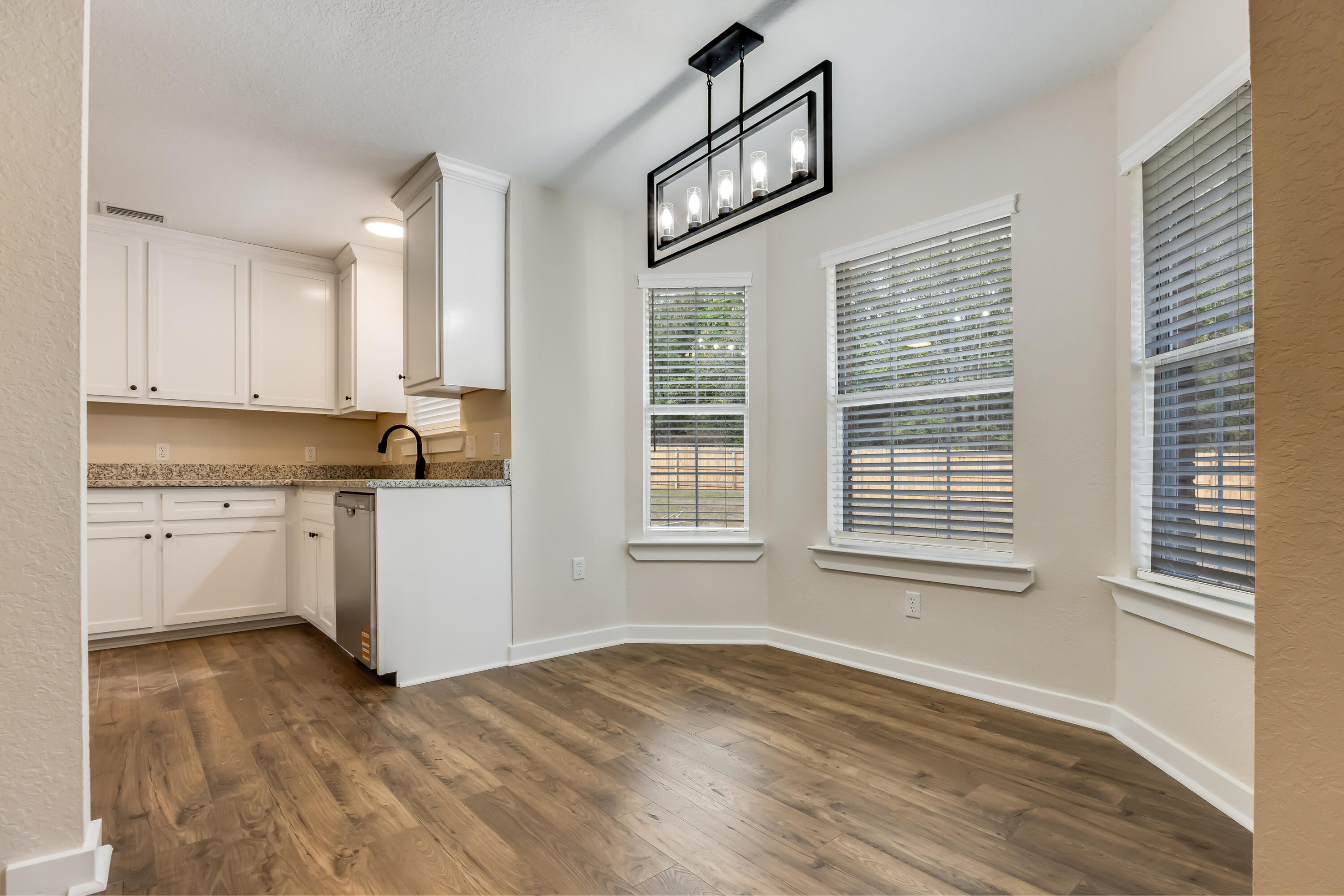 3005 Lillie Street Crestview, FL 32539 - Photo 15 of 46 a view of a kitchen with wooden cabinet and a window