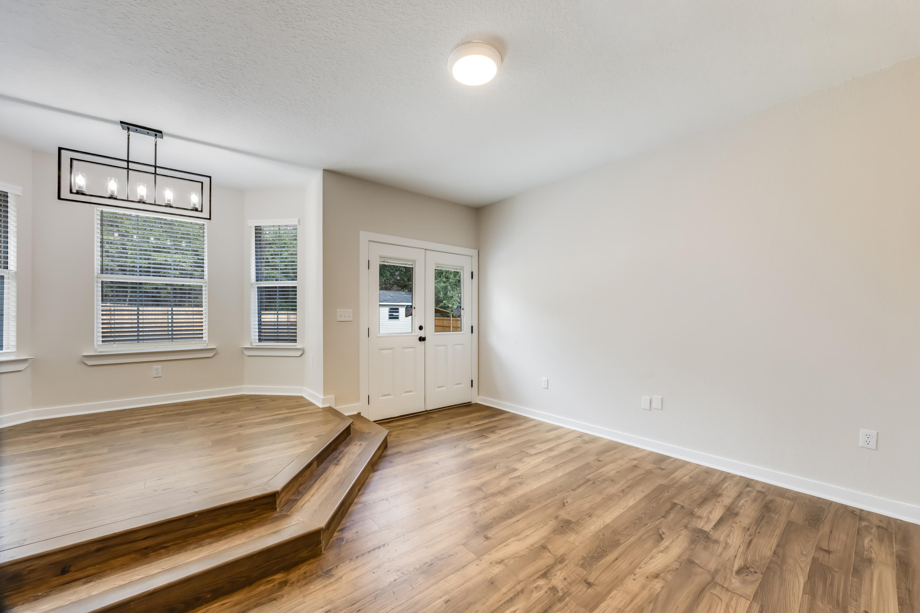 3005 Lillie Street Crestview, FL 32539 - Photo 18 of 46 an empty room with windows