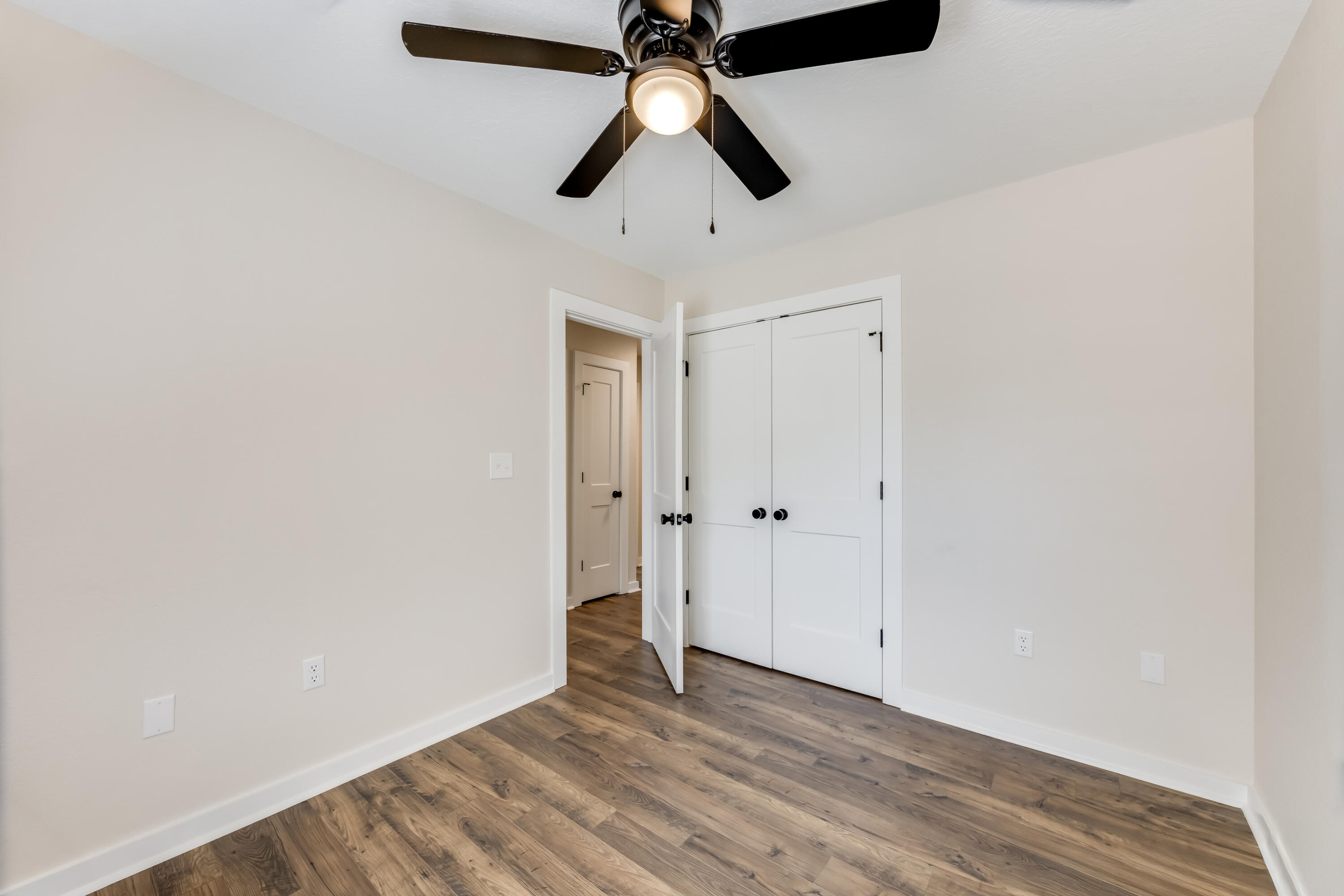 3005 Lillie Street Crestview, FL 32539 - Photo 26 of 46 a view of an empty room with wooden floor