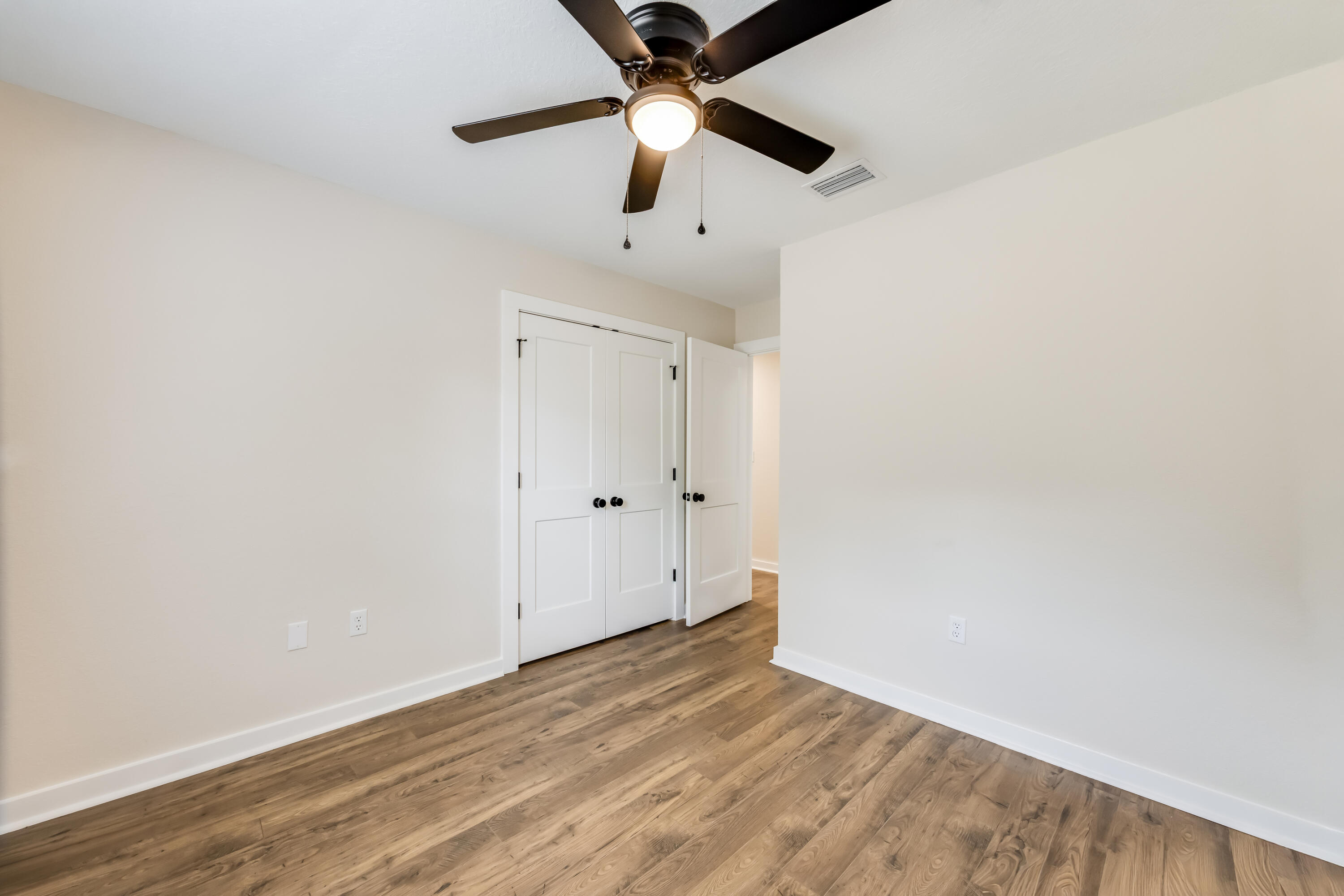 3005 Lillie Street Crestview, FL 32539 - Photo 28 of 46 wooden floor in an empty room