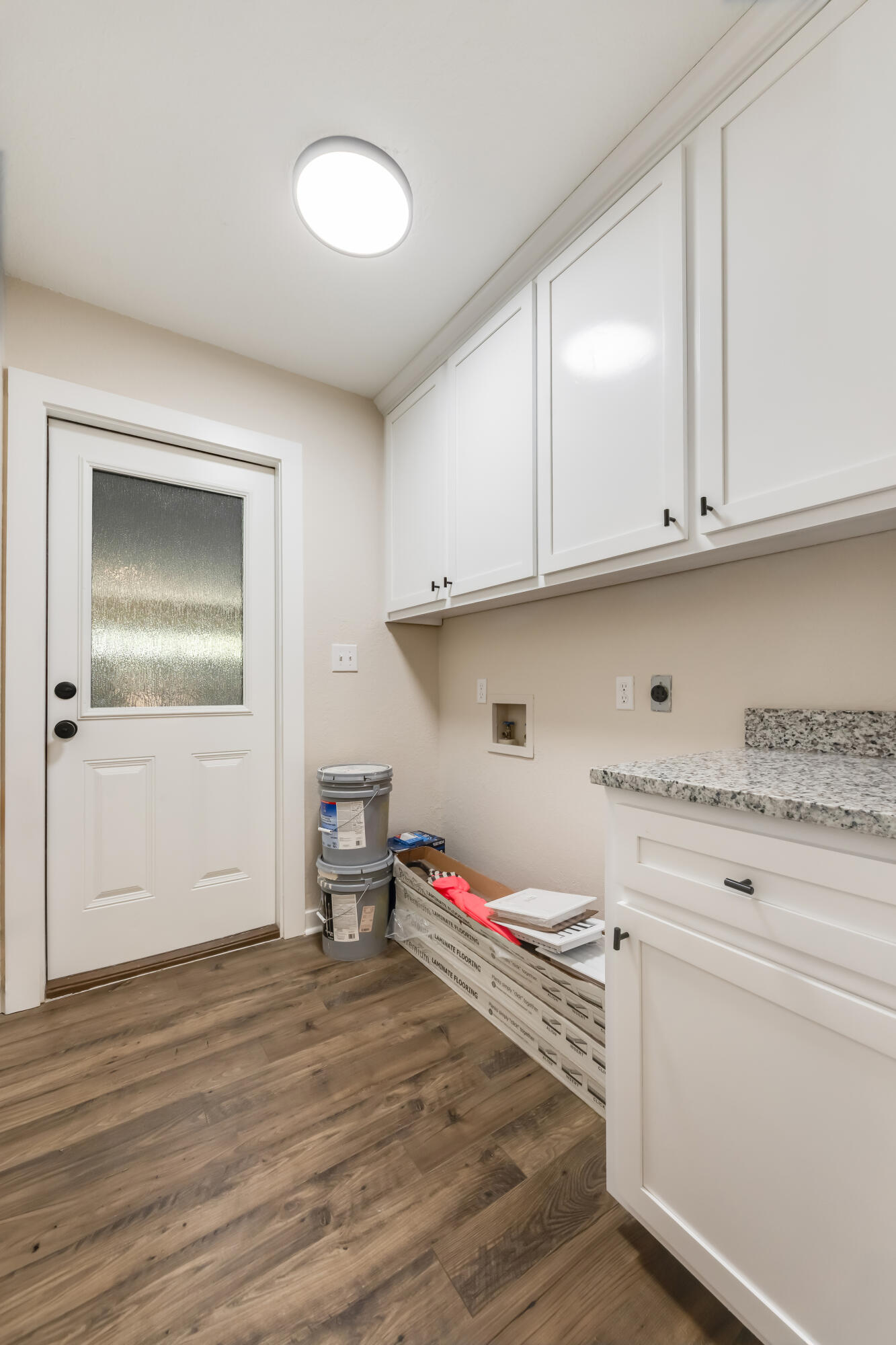 3005 Lillie Street Crestview, FL 32539 - Photo 31 of 46 a storage room with wooden floor and cabinets
