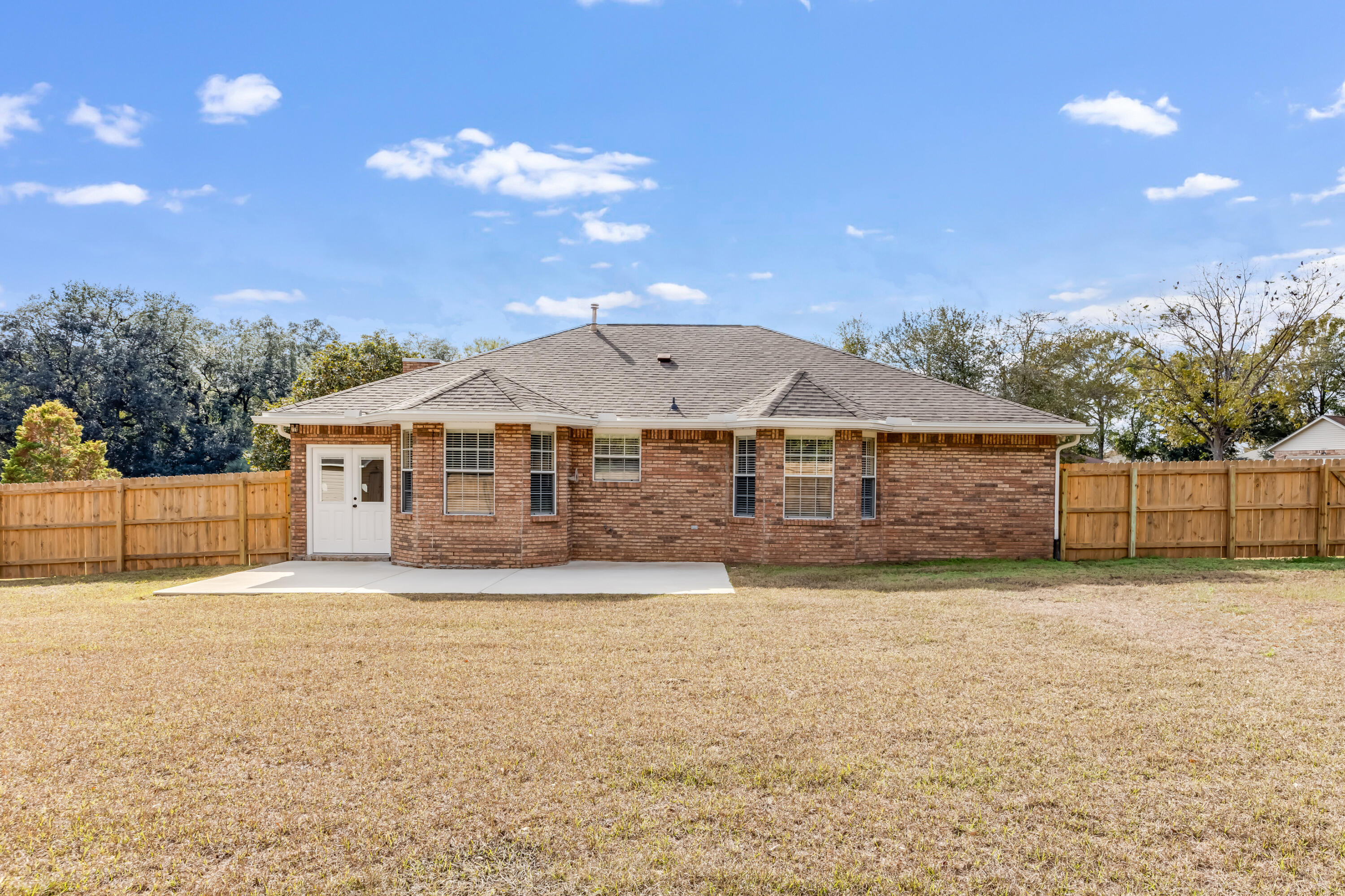 3005 Lillie Street Crestview, FL 32539 - Photo 34 of 46 a view of a house with a yard