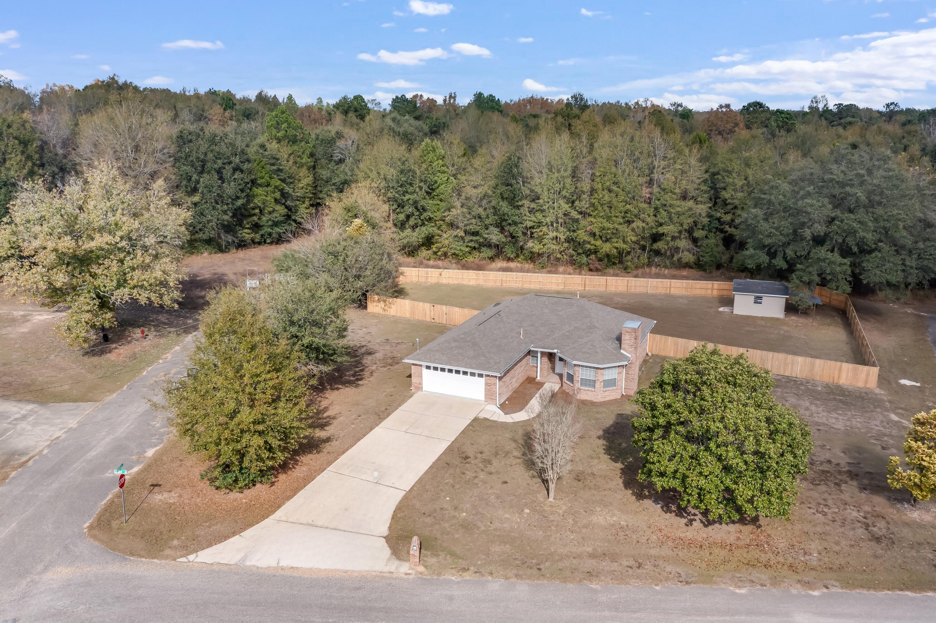 3005 Lillie Street Crestview, FL 32539 - Photo 41 of 46 a view of a terrace with a yard