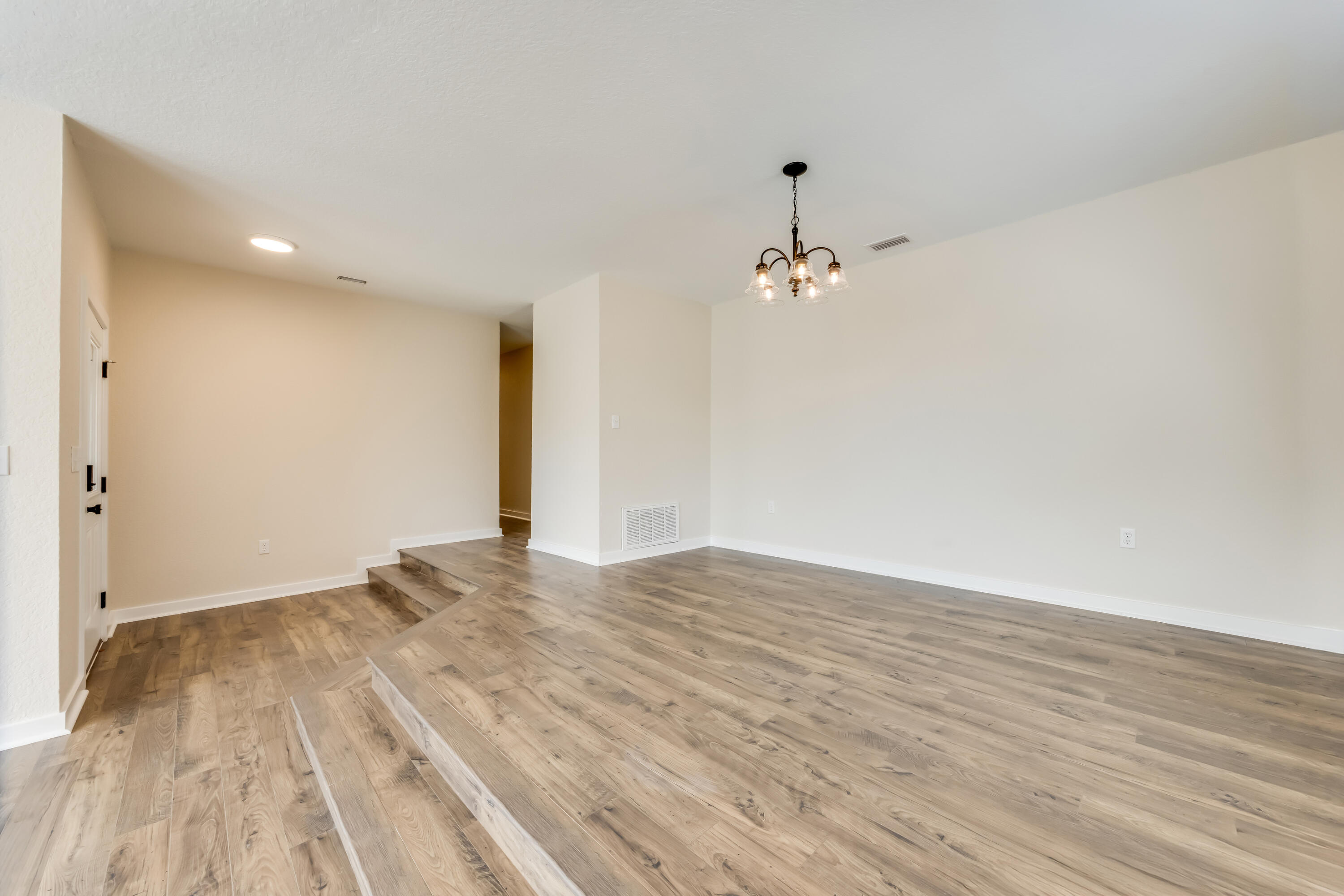 3005 Lillie Street Crestview, FL 32539 - Photo 5 of 46 a view of a room with wooden floor