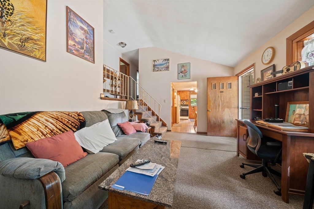 4 Lakeview Road Foxboro, MA 02035 - Photo 13 of 32 a living room with furniture a flat screen tv and a fireplace