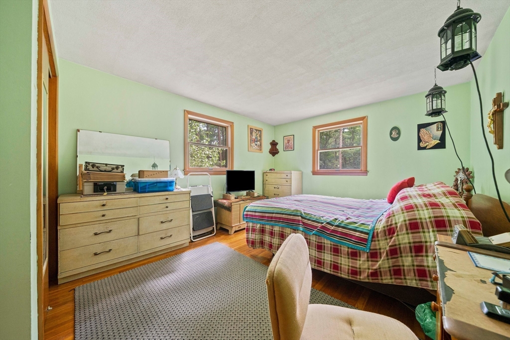 4 Lakeview Road Foxboro, MA 02035 - Photo 14 of 32 a bedroom with a bed and a dresser in it