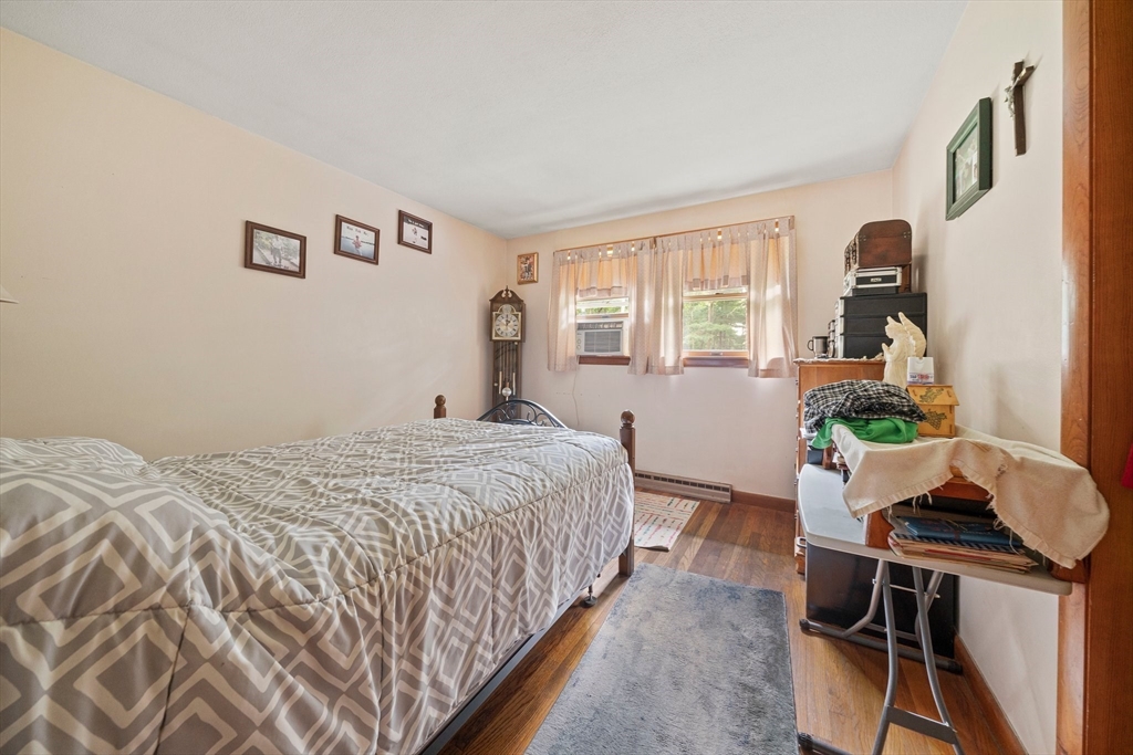 4 Lakeview Road Foxboro, MA 02035 - Photo 15 of 32 a bedroom with a bed and windows