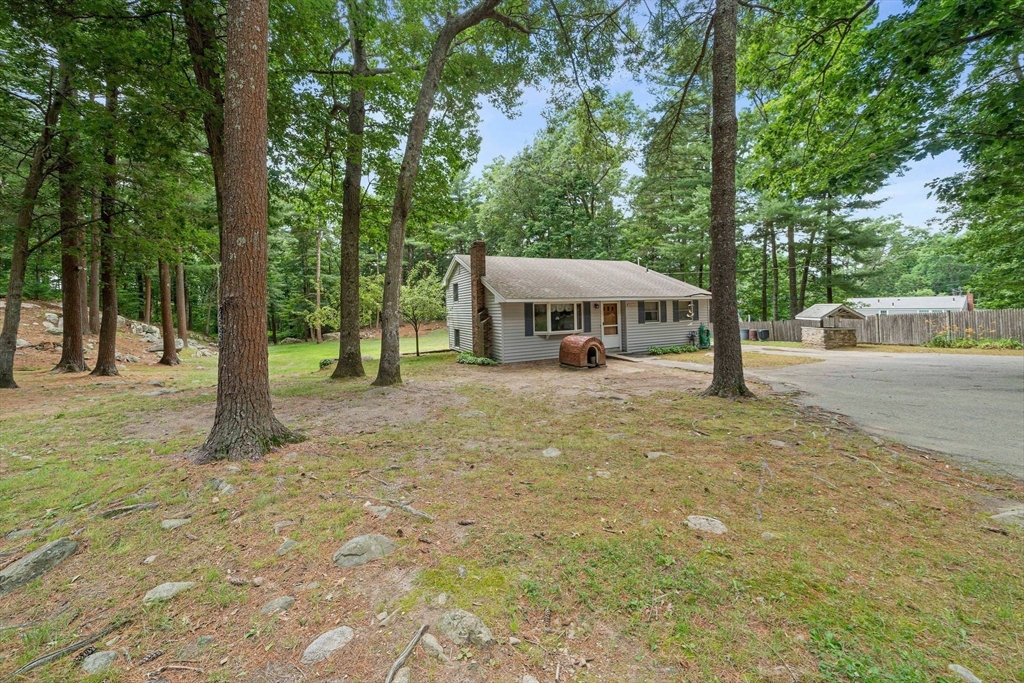 4 Lakeview Road Foxboro, MA 02035 - Photo 23 of 32 a view of a house with large trees and a yard