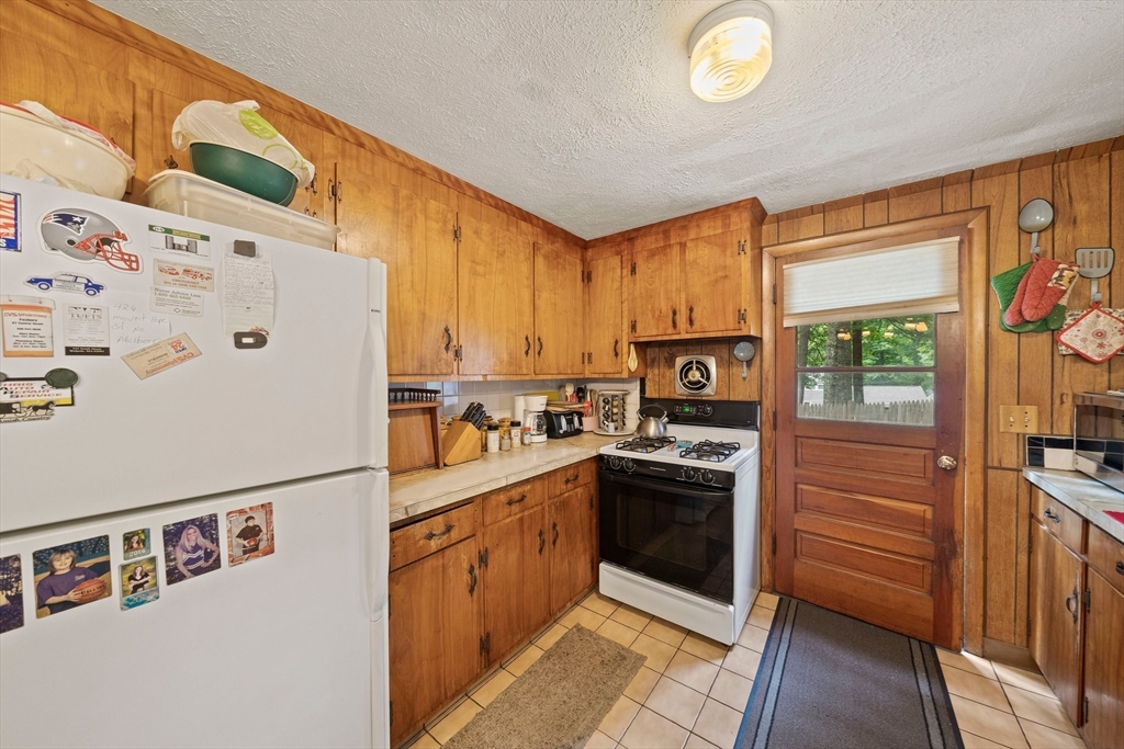 4 Lakeview Road Foxboro, MA 02035 - Photo 10 of 32 a kitchen with stainless steel appliances granite countertop a refrigerator a stove a sink and a cabinets