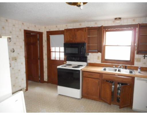 175 Turner Road Scituate, MA 02066 - Photo 14 of 24 a kitchen with a stove a sink and a refrigerator