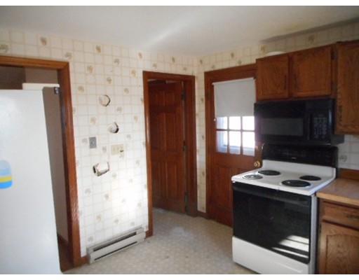 175 Turner Road Scituate, MA 02066 - Photo 18 of 24 a kitchen with a refrigerator and a stove top oven