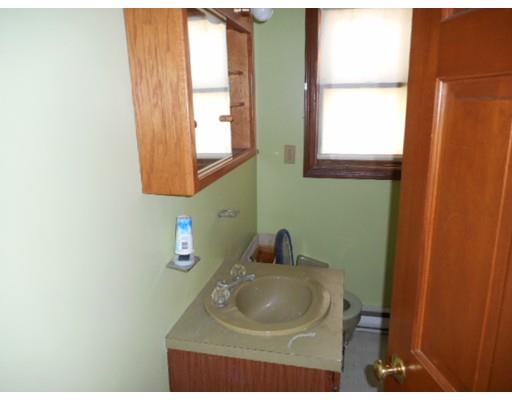 175 Turner Road Scituate, MA 02066 - Photo 21 of 24 a bathroom with a sink and a mirror