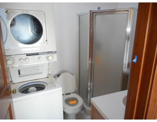 175 Turner Road Scituate, MA 02066 - Photo 23 of 24 a bathroom with a sink a toilet and a mirror