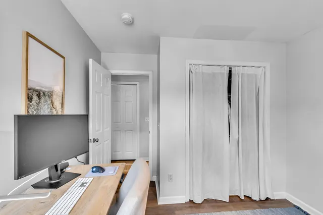 a view of a hallway with workspace