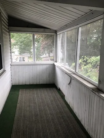 a view of a room with large windows