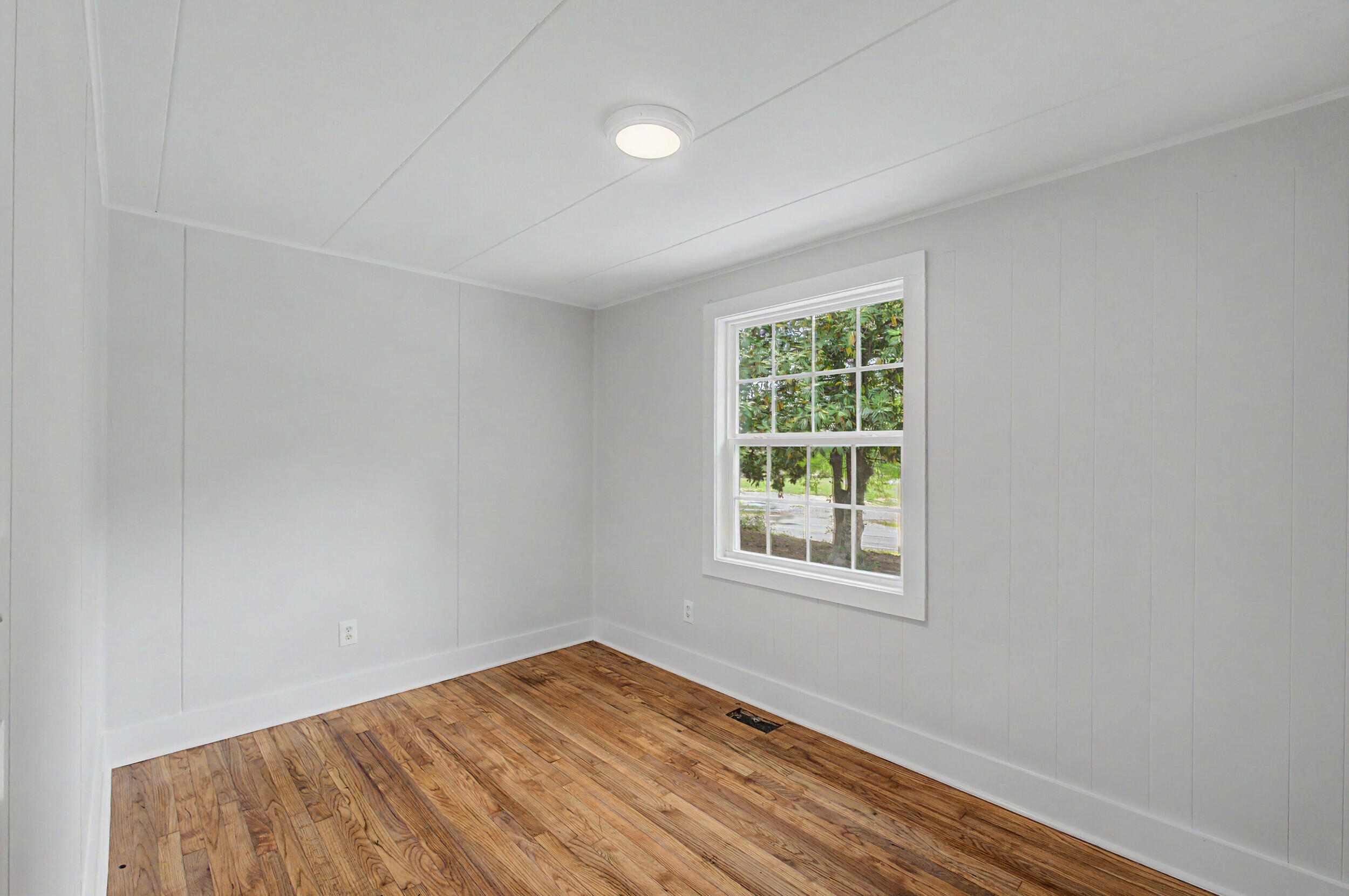 3016 Wagener Road Aiken, SC 29801 - Photo 24 of 29 an empty room with wooden floor and windows