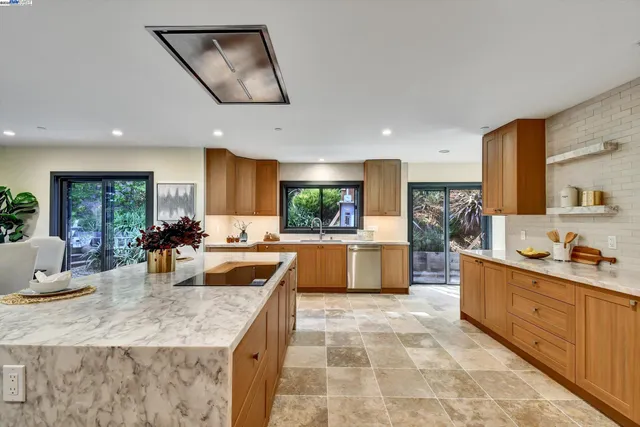a kitchen with sink a counter and cabinets
