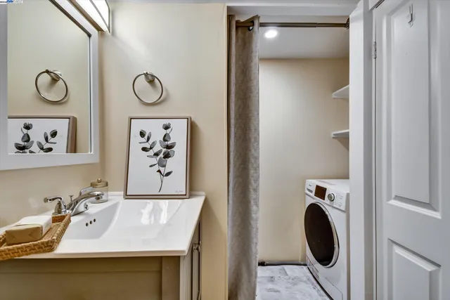 a view of a sink and cabinets