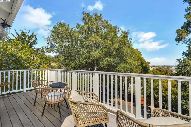 a view of a wooden deck with a bench