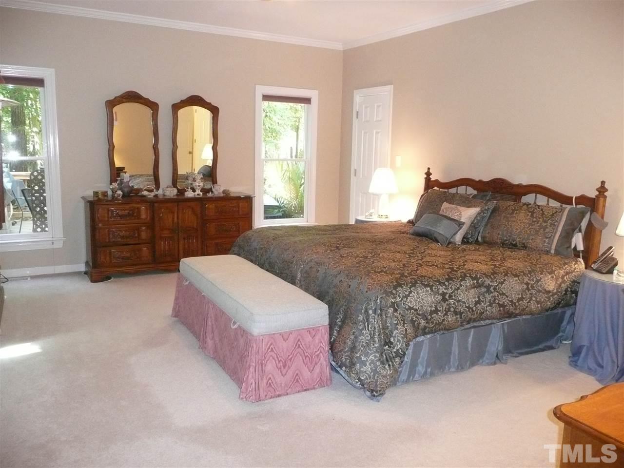 2604 Sunnystone Way Raleigh, NC 27613 - Photo 11 of 25 a bed room with a bed and a couch