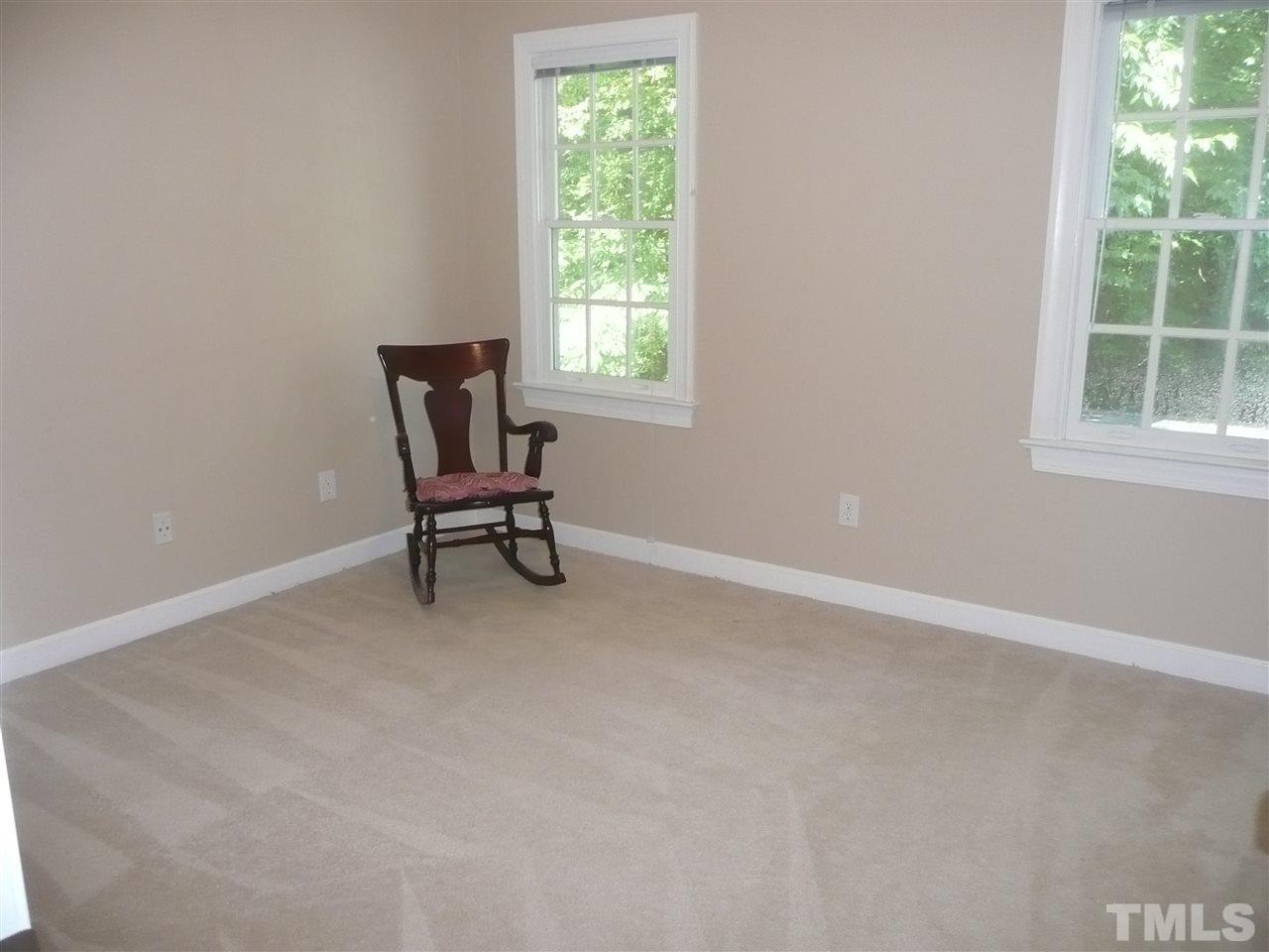 2604 Sunnystone Way Raleigh, NC 27613 - Photo 17 of 25 a living room with furniture and a window