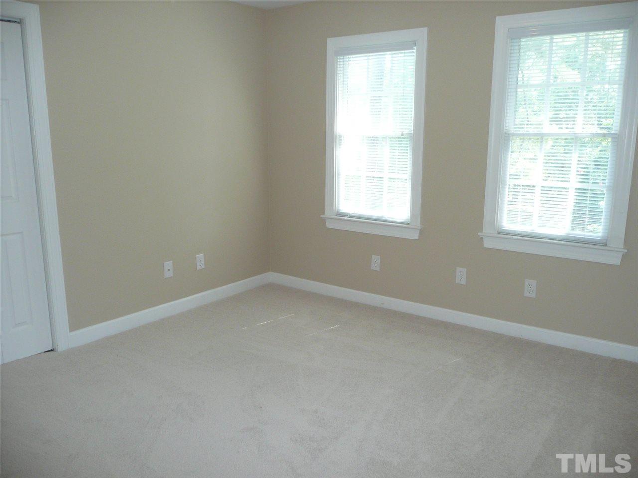 2604 Sunnystone Way Raleigh, NC 27613 - Photo 18 of 25 an empty room with a window