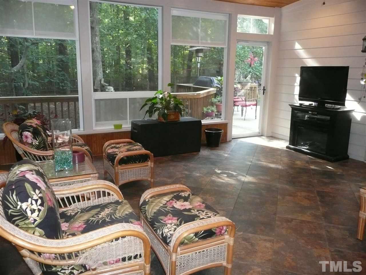 2604 Sunnystone Way Raleigh, NC 27613 - Photo 20 of 25 a living room with furniture and a flat screen tv