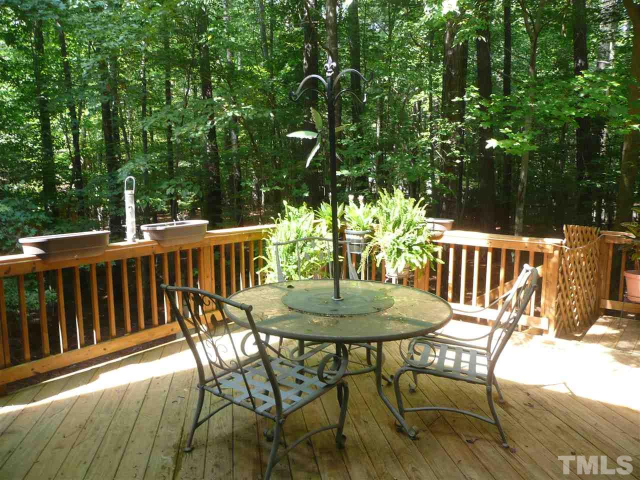 2604 Sunnystone Way Raleigh, NC 27613 - Photo 22 of 25 a view of a table and chairs on the roof deck