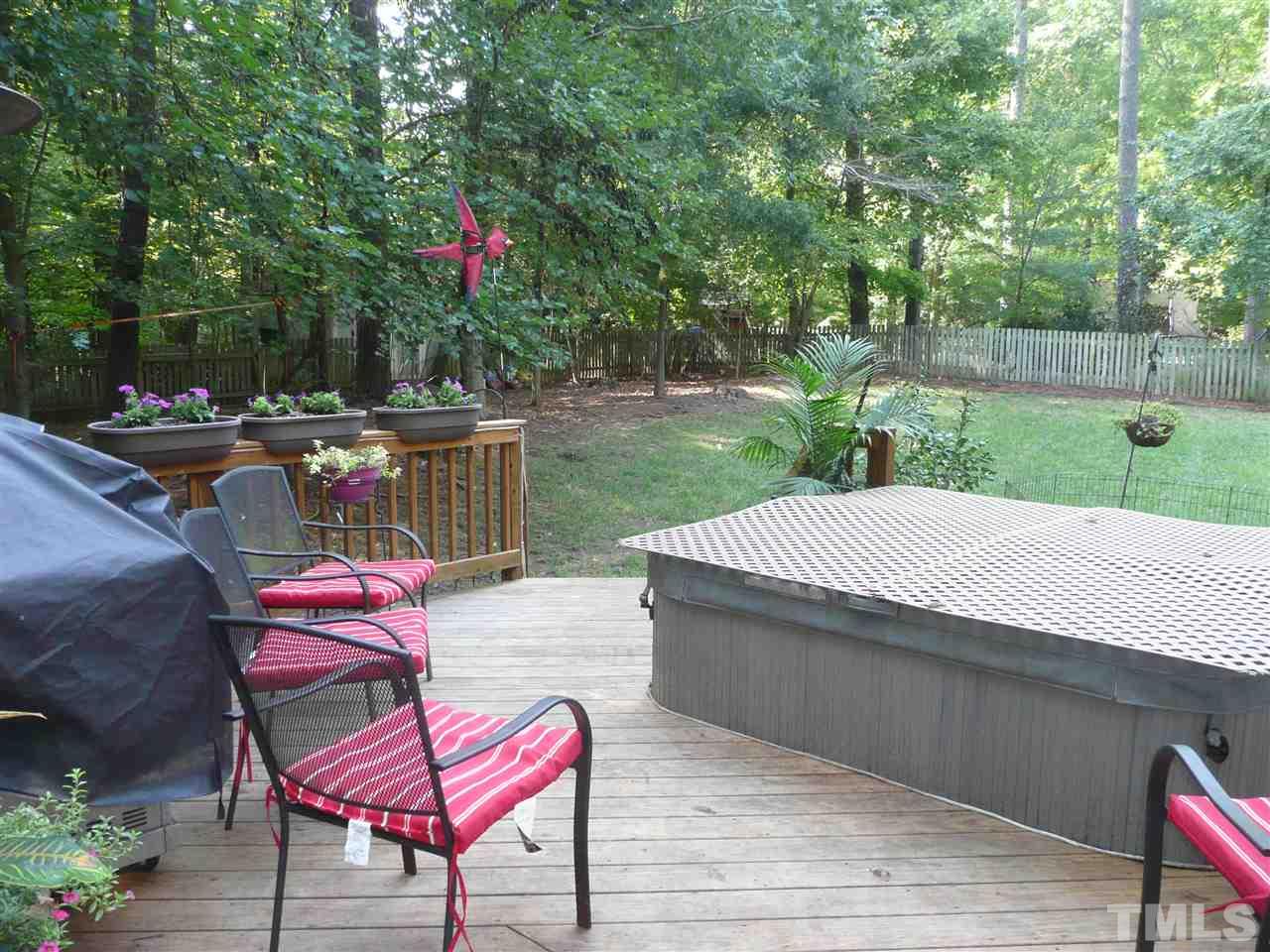2604 Sunnystone Way Raleigh, NC 27613 - Photo 23 of 25 an outdoor sitting area with furniture and garden