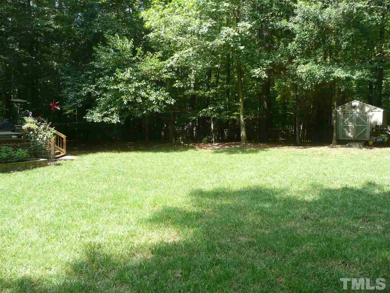 2604 Sunnystone Way Raleigh, NC 27613 - Photo 24 of 25 a view of yard with trees