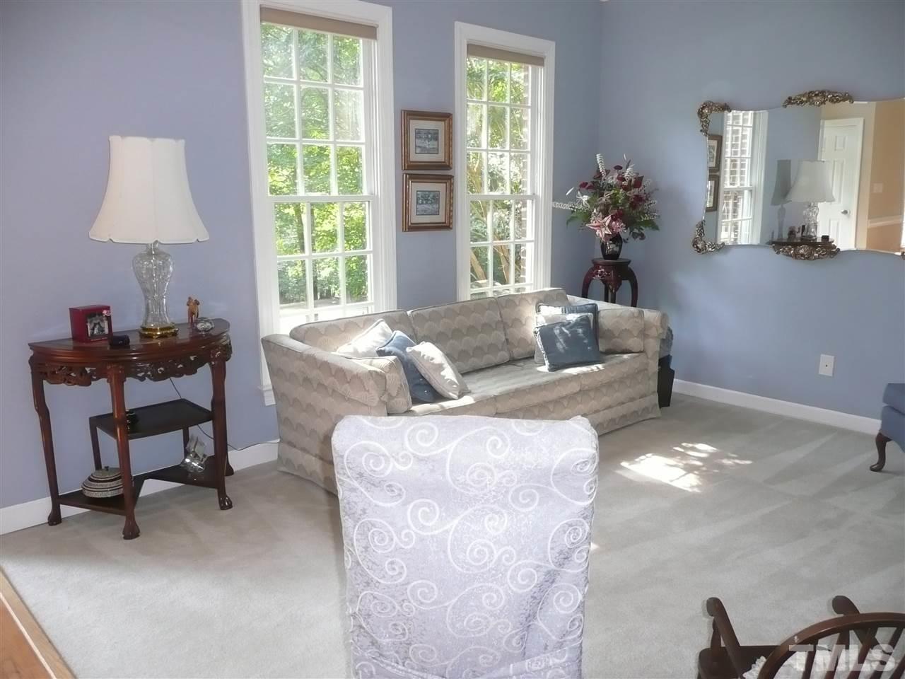 2604 Sunnystone Way Raleigh, NC 27613 - Photo 4 of 25 a living room with furniture and a window