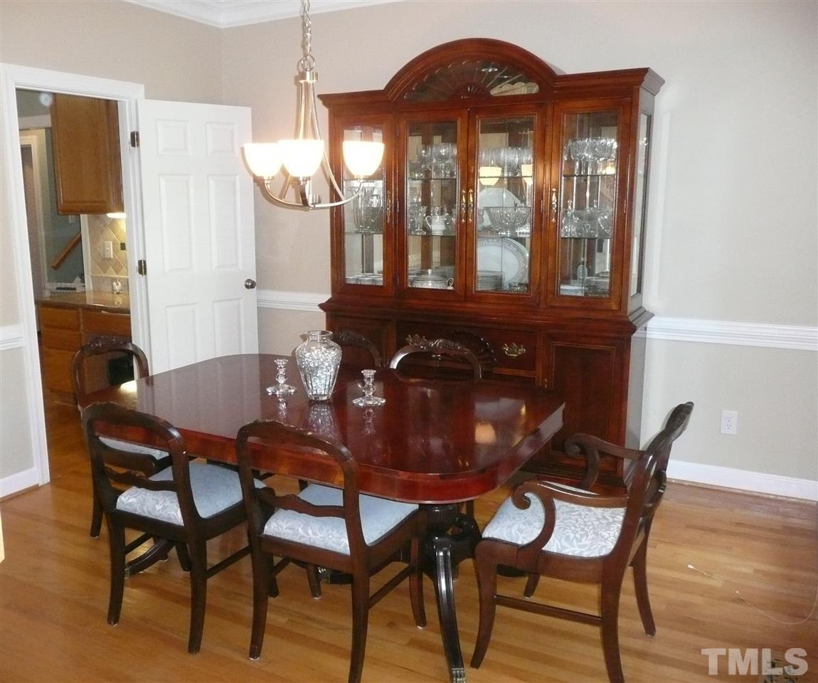 2604 Sunnystone Way Raleigh, NC 27613 - Photo 5 of 25 a view of a dining room with furniture and window